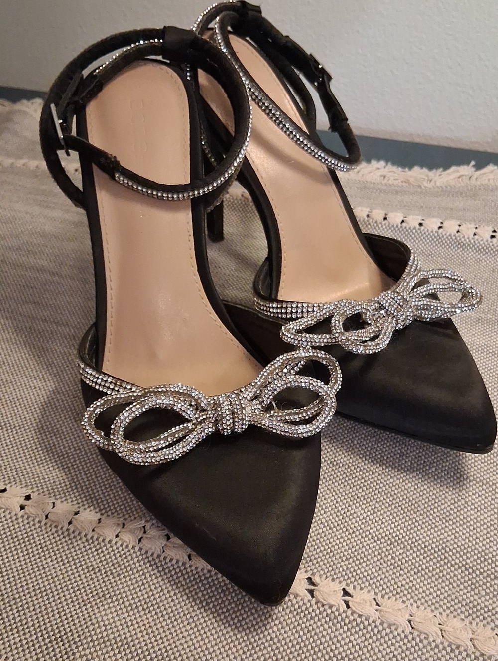 BCBGeneration Black Satin Pointed Heels with Crystal Bow Accent